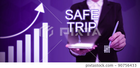 Conceptual display Safe Trip. Internet Concept wishing someone to reach his destination in good health Businessman in suit holding tablet symbolizing successful teamwork. 90756433