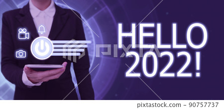 Writing displaying text Hello 2022. Word Written on Hoping for a greatness to happen for the coming new year Lady in suit holding pen symbolizing successful teamwork accomplishments. Writing displaying text Hello 2022. Word Written on Hoping for a greatness to happen for the coming new year Lady in suit holding pen symbolizing successful teamwork accomplishments. 90757737