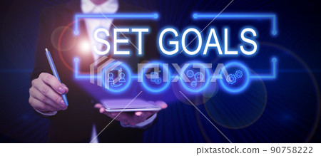 Inspiration showing sign Set Goals. Internet Concept Defining or achieving something in the future based on plan Businesswoman Casual Standing Presenting Charts And New Wonderful Ideas. 90758222