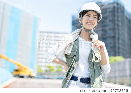 A woman working at a construction site A woman working at a construction site 90758736