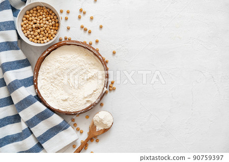 Chickpea and flour in ceramic bowl on white background Chickpea and flour in ceramic bowl on white background 90759397