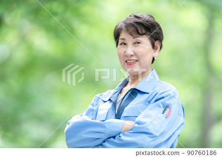 Woman in work clothes, fresh green portrait Woman in work clothes, fresh green portrait 90760186