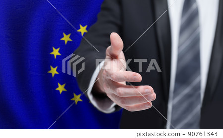 Welcome to the European Union. Hand on flag background. Welcome to the European Union. Hand on flag background. 90761343