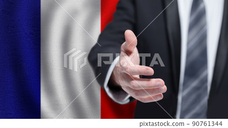 Business, politics, cooperation and travel in France concept. Hand on French flag background. Business, politics, cooperation and travel in France concept. Hand on French flag background. 90761344
