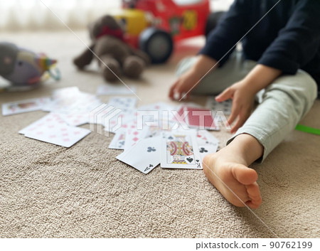 Playing cards, toys and children Playing cards, toys and children 90762199