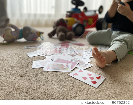 Playing cards, toys and children Playing cards, toys and children 90762202