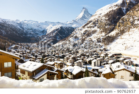 Winter mountain landscape. Snowy mountain Matterhorn during the day in winter. Zermatt, swiss alps Winter mountain landscape. Snowy mountain Matterhorn during the day in winter. Zermatt, swiss alps 90762657