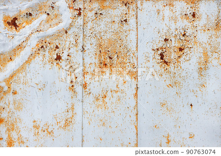 Texture of an old rusty metal sheet covered with peeling paint. Texture of an old rusty metal sheet covered with peeling paint. 90763074