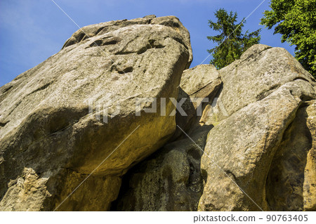 rocks with recesses for the wooden beams in Tustan fortress place, Skole Beskids National Nature Park, Lviv region, Ukraine 90763405