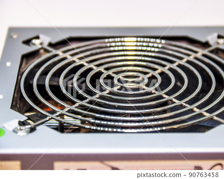 the power supply for the computer on white background 90763458