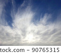 A fiery white cirrus cloud 90765315