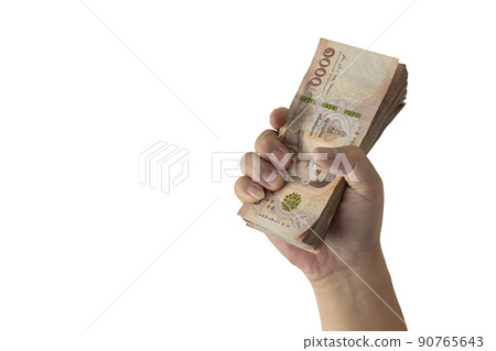 Image of a man holding a large number of banknotes with his right hand (Thai banknotes)  ,with Clipping Path. 90765643