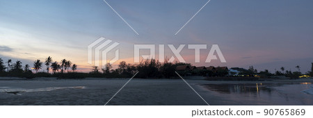Panorama ,Coconut trees and trees separating the beach "Chao Samran" and the road , Sky in the evening after sunset. Panorama ,Coconut trees and trees separating the beach "Chao Samran" and the road , Sky in the evening after sunset. 90765869