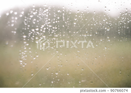 Natural pattern of rain drops on window glass surface. Natural pattern of rain drops on window glass surface. 90766074