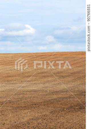 tillage in the agricultural field for planting a new crop 90766881