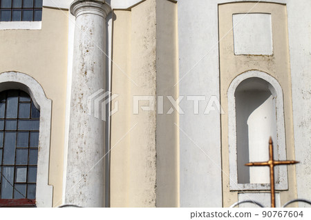 Catholic crosses near the Catholic church building 90767604