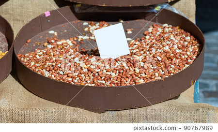 Peanuts on a market stall in Greece with space for an inscription 90767989