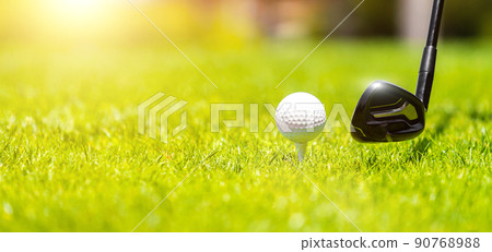 Golf iron club ready to hit a ball on green grass on golf course 90768988