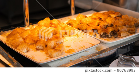 Rolls of puff pastry with cheese in hotel buffet 90768992