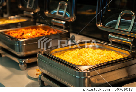 Buffet heated trays ready for service with pasta choice for breakfast Buffet heated trays ready for service with pasta choice for breakfast 90769018