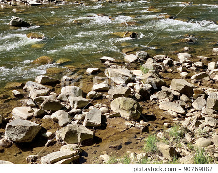 Spring view of flowing Prut river in Yaremche in Carpathian region in Ukraine. Selective focus 90769082