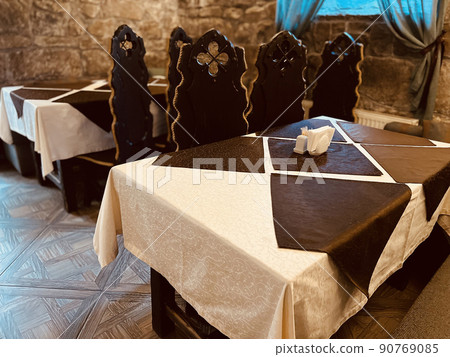 Empty chairs and tables in the cafe or restaurant. Selective focus 90769085