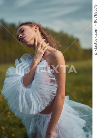 Sexy blonde in dress posing in nature. Art portrait of nude woma Sexy blonde in dress posing in nature. Art portrait of nude woma 90769579