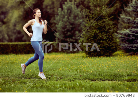 Health running in city park by young woman. Health running in city park by young woman. 90769948