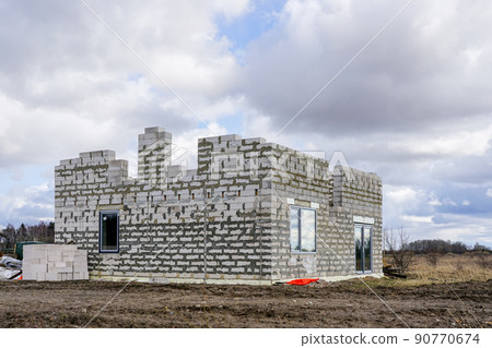 concrete blocks frame of a new private house under construction 90770674