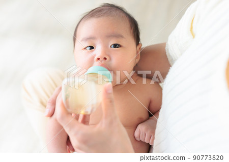 Baby drinking milk 1 month old copy space Baby drinking milk 1 month old copy space 90773820