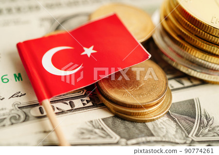 Stack of coins with Turkey flag on USA America dollar banknotes. Stack of coins with Turkey flag on USA America dollar banknotes. 90774261