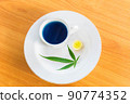 Cup of Marijuana herb and lemon hot tea on the plate. 90774352