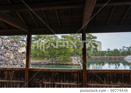 Moat and Ishigaki seen from the sheath bridge of Takamatsu Castle, Takamatsu City, Kagawa Prefecture Moat and Ishigaki seen from the sheath bridge of Takamatsu Castle, Takamatsu City, Kagawa Prefecture 90774436