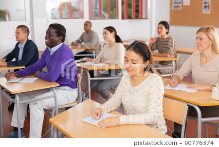 Young woman working during group business training 90776374