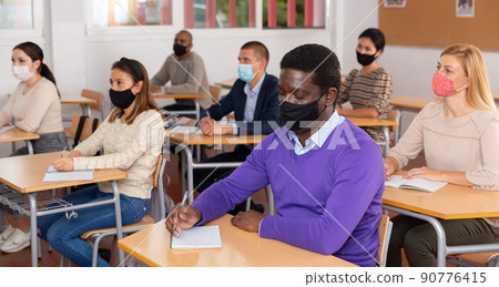 Adult African American in protective mask at refresher course 90776415
