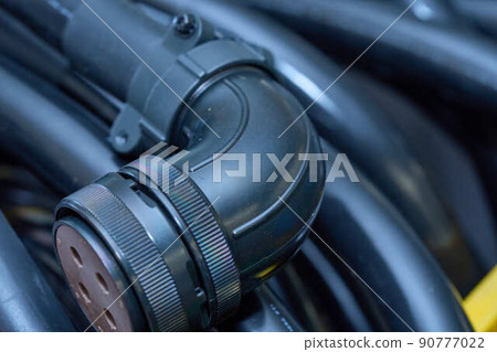 Wire being processed to connect to a machine Wire being processed to connect to a machine 90777022