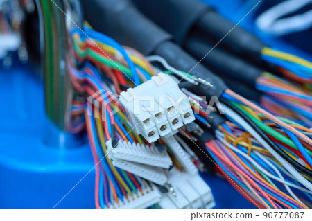 Wire being processed to connect to a machine 90777087