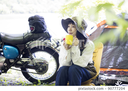 Bike girl chairing image Bike girl doing solo can on the lakeside 90777204