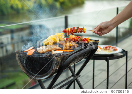 delicious grilled meat with smoke, BBQ with vegetables in outdoor. Barbecue, Party, lifestyle and picnic concept delicious grilled meat with smoke, BBQ with vegetables in outdoor. Barbecue, Party, lifestyle and picnic concept 90780146