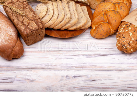 Different types of bread isolated on white background. Empty space. Different types of bread isolated on white background. Empty space. 90780772