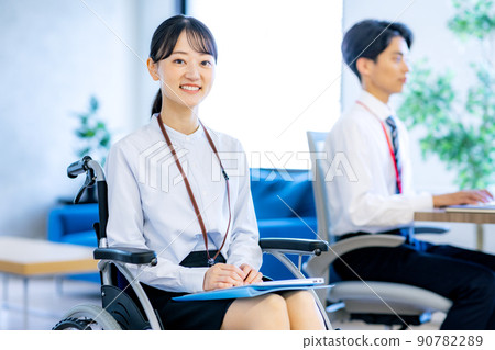 Young woman sitting on wheelchair 90782289