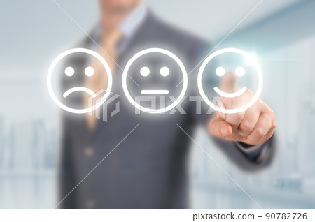 Businessman pressing excellent smiley face rating icon over light blue background, Business customer service evaluation and feedback rating concept. man pointing on happy smiling face 90782726