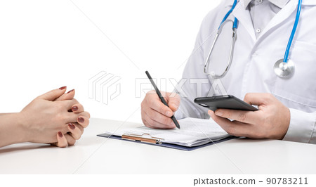 Patient and doctor taking notes. Doctor prescribing medication for patient. Unknown man doctor and female patient sitting and talking at medical examination in clinic. isolated on white. Patient and doctor taking notes. Doctor prescribing medication for patient. Unknown man doctor and female patient sitting and talking at medical examination in clinic. isolated on white. 90783211
