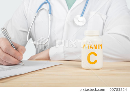 Essential vitamin C and minerals for humans. doctor recommends taking vitamin C. doctor talks about Benefits of vitamin C. C Vitamin - Health Concept 90783224