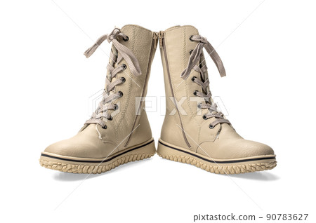 boots with high lacing. winter beige women's boots with lacing. isolated on white background. comfortable winter boots for women 90783627