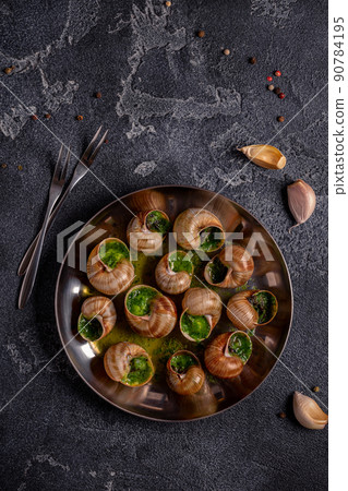 Bourgogne Escargot Snails with herb garlic oil. 90784195