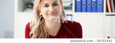 Beautiful young woman office worker posing in personal cabinet 90785442