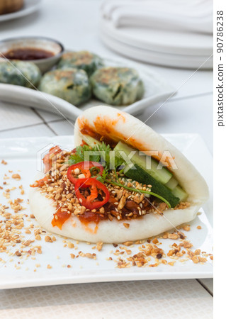 Taiwanese Food Gua Bao, Asian hamburger or sandwich from steamed rice bun with red-cooked pork belly. 90786238