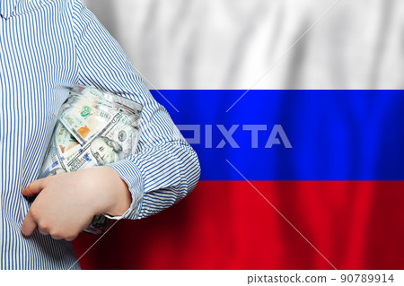 100 US dollars cash banknotes in glass jar againstn Russian flag background 90789914