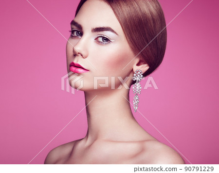 Fashion portrait of young beautiful woman with jewelry Fashion portrait of young beautiful woman with jewelry 90791229